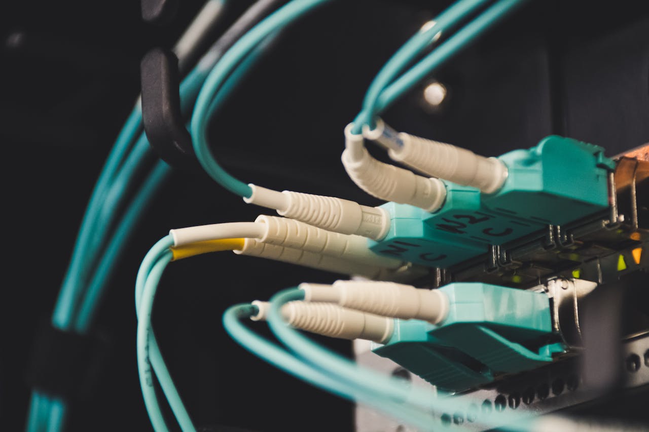 journey Detailed view of fiber optic cables and ports in a server room, showcasing connectivity.