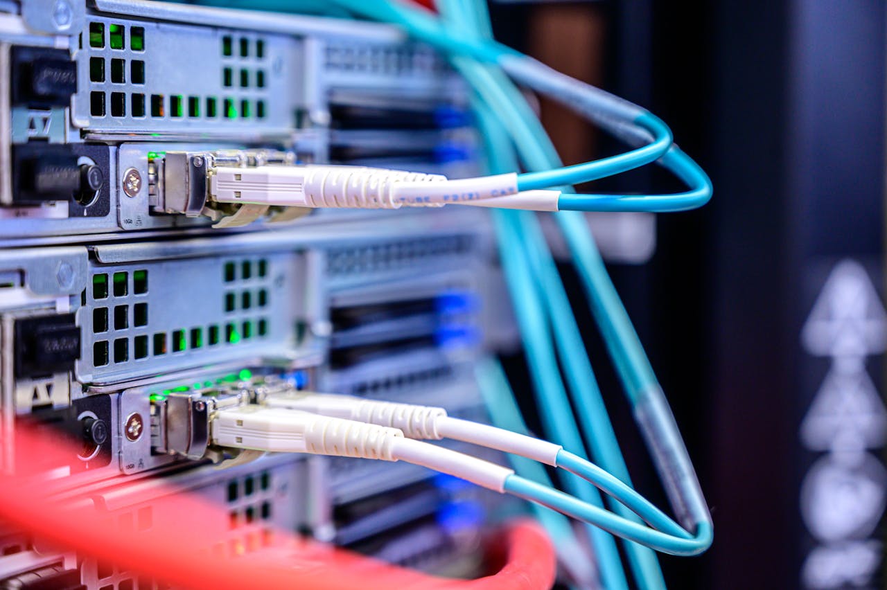 why-choose-us Detailed shot of Ethernet cables connected to server ports highlighting technology infrastructure.